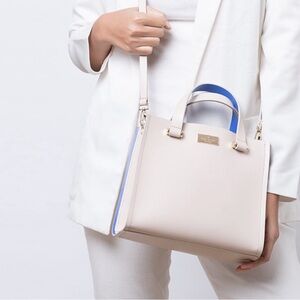 Kate spade cream colored crossbody bag with electric blue highlights